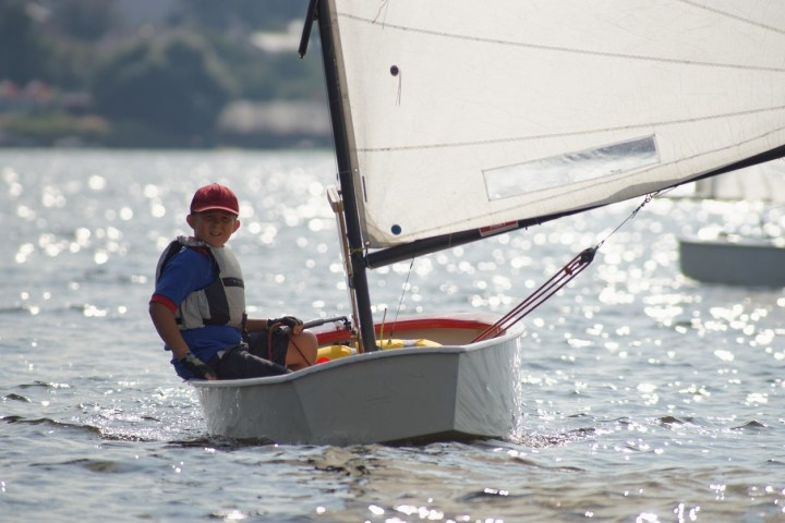 a man riding on the back of a boat