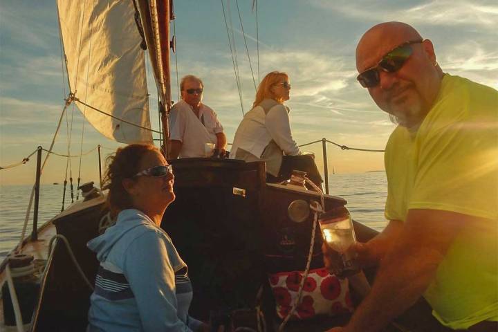 a couple of people on a boat in the water