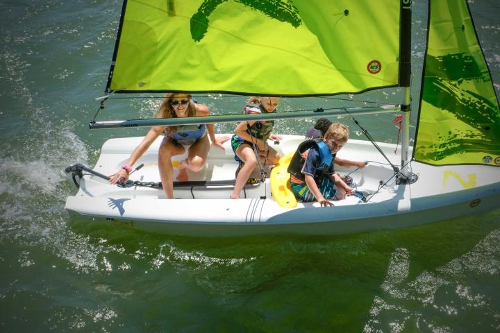 a group of people on a boat in the water