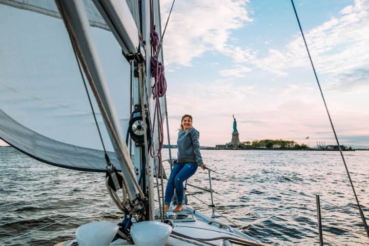 a person riding on the back of a boat in a body of water