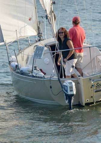 a group of people in a small boat in a body of water